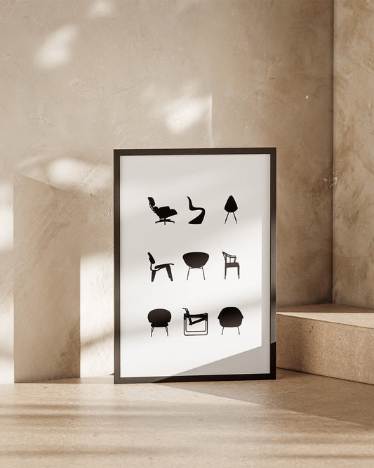 Framed poster with black and white illustrations of iconic chairs on a beige wall.