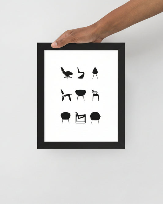 Framed artwork with black line drawings of chairs on a white background, held by a hand.