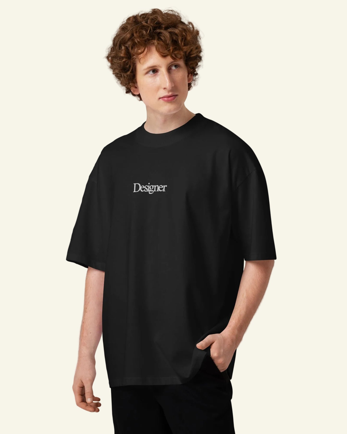 Person wearing a black t-shirt with 'Designer' text on a white background